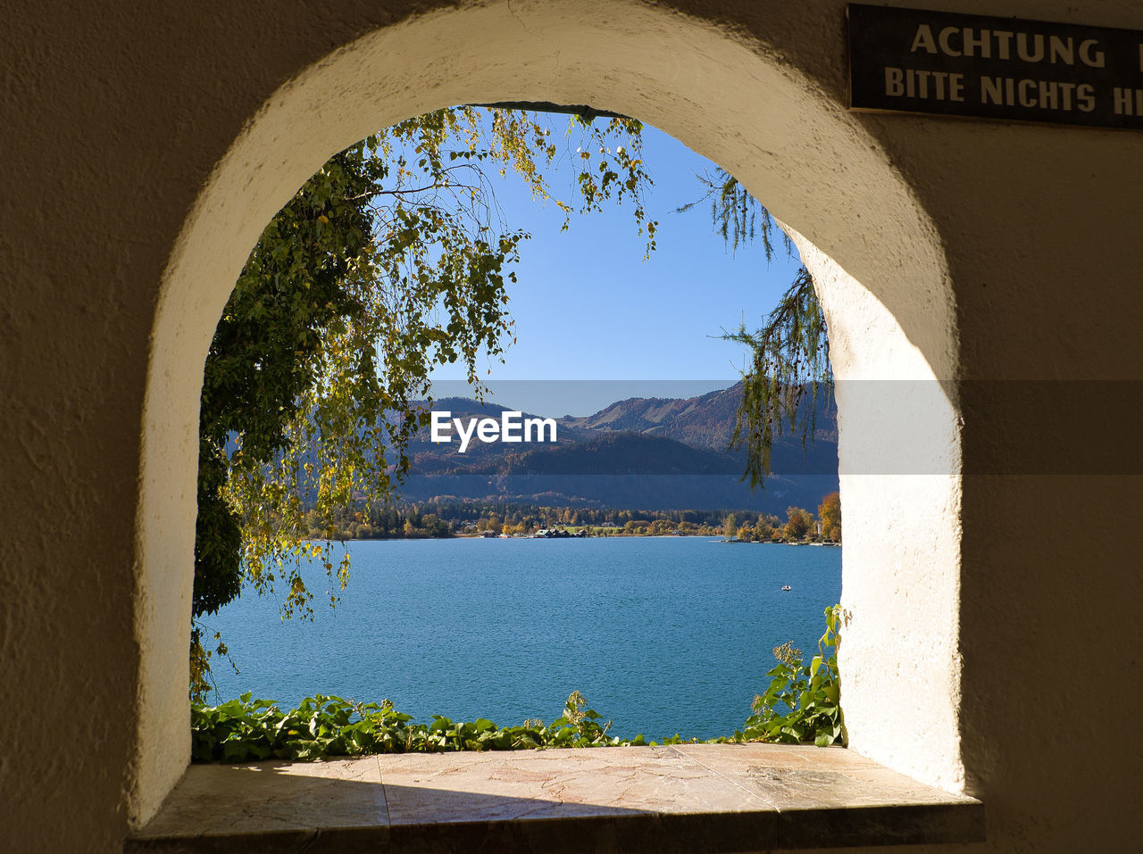 SCENIC VIEW OF MOUNTAINS AGAINST SKY SEEN THROUGH WINDOW