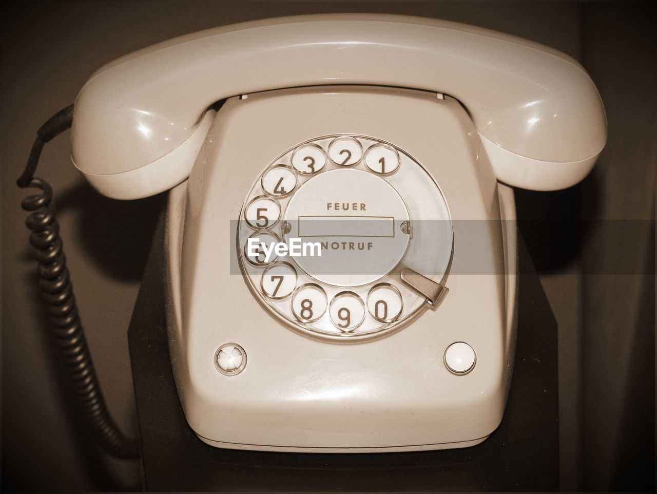 Close-up of telephone booth on table