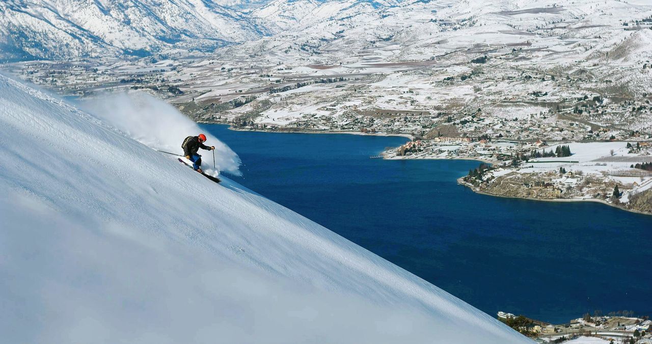 Man skiing on snow covered landscape