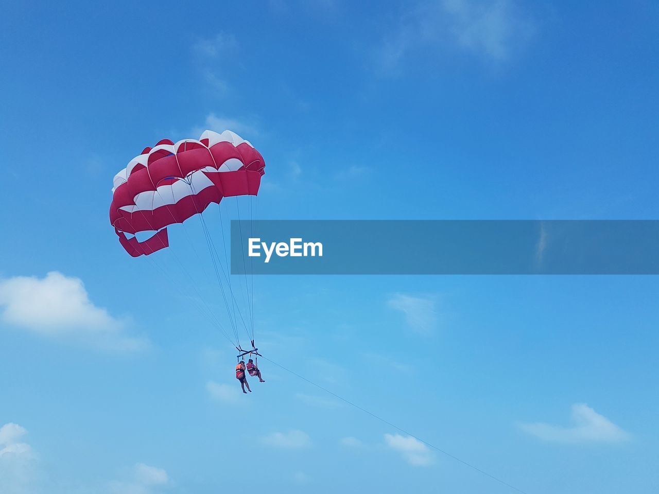 LOW ANGLE VIEW OF PERSON FLYING AGAINST SKY