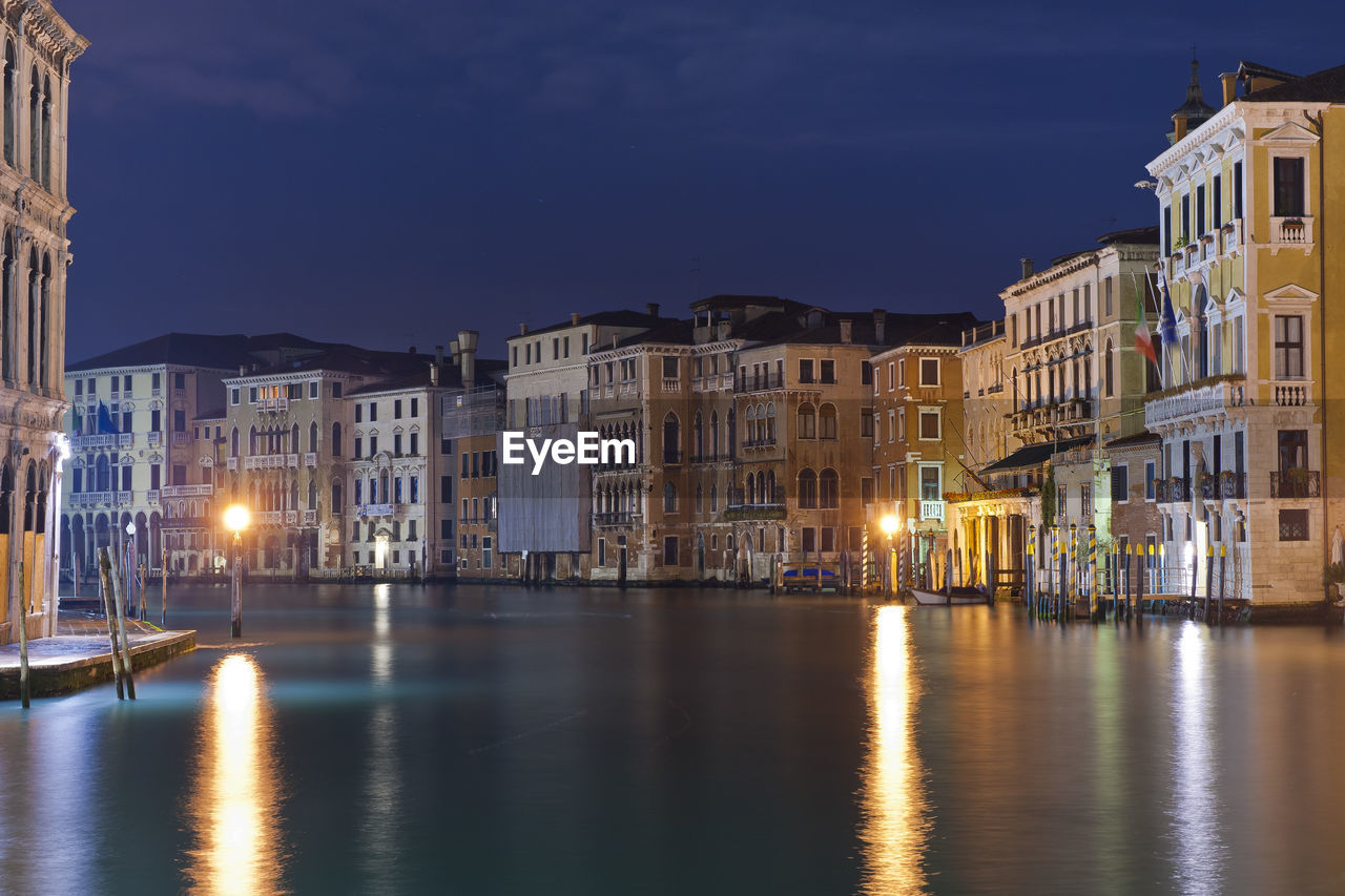 Reflection of buildings in city at night