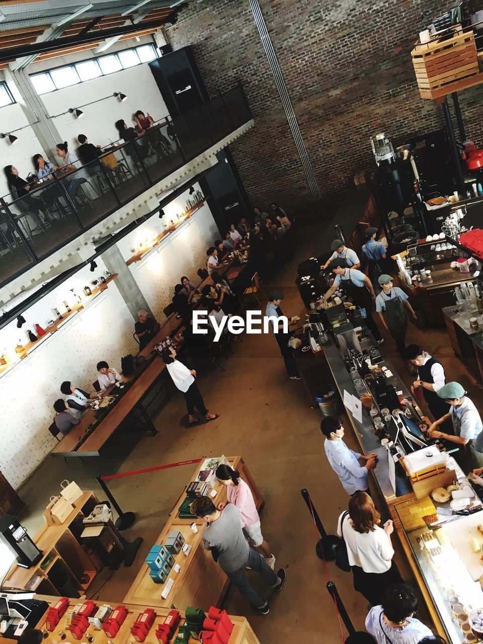 HIGH ANGLE VIEW OF CROWD IN OFFICE