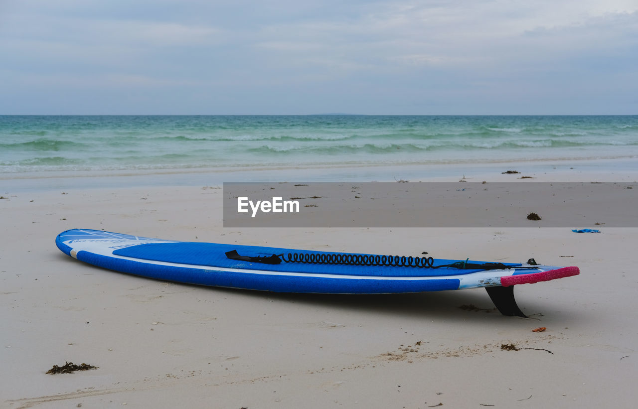 Surfboard by the beach