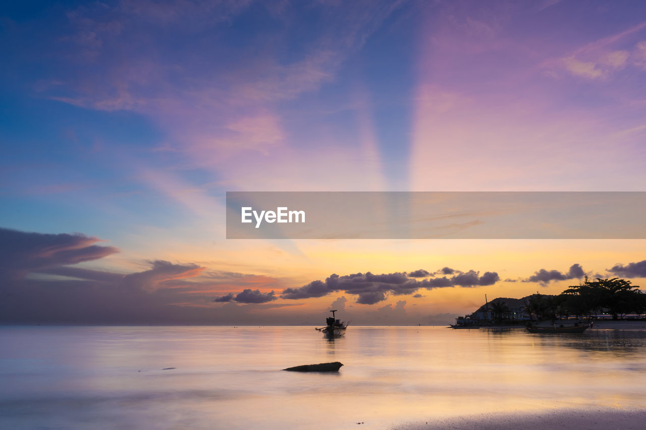 SCENIC VIEW OF SEA DURING SUNSET