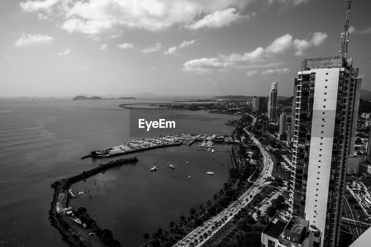 water, architecture, sky, built structure, city, black and white, building exterior, nature, sea, cloud, travel destinations, monochrome photography, cityscape, building, monochrome, transportation, landscape, skyscraper, aerial photography, horizon, high angle view, no people, travel, outdoors, aerial view, urban skyline, beach, tourism, day, office building exterior, coast, tower, scenics - nature, nautical vessel