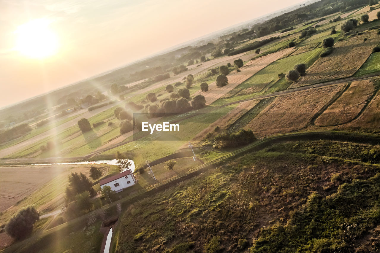 Aerial view of agricultural field against sky