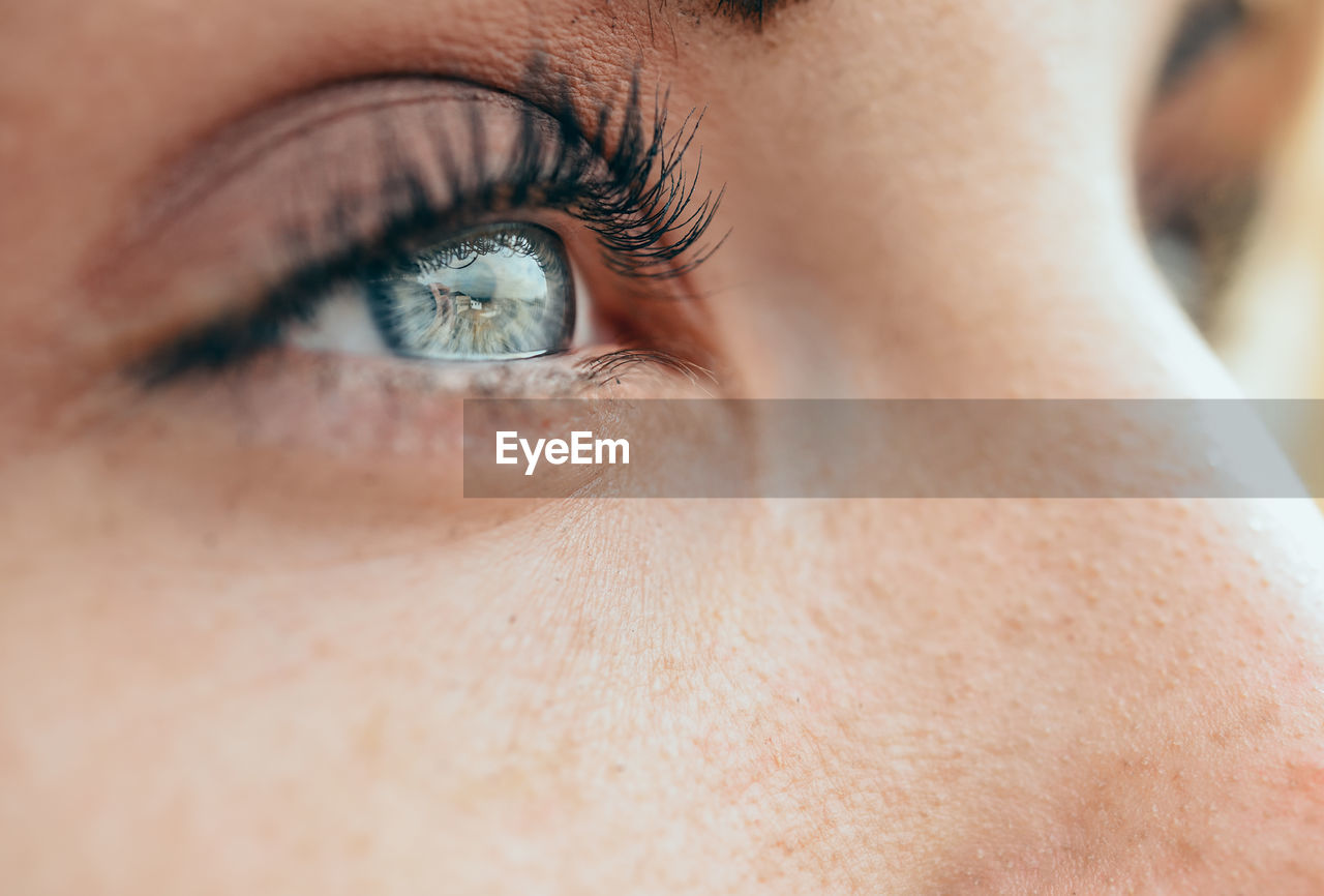 Cropped eye of young woman