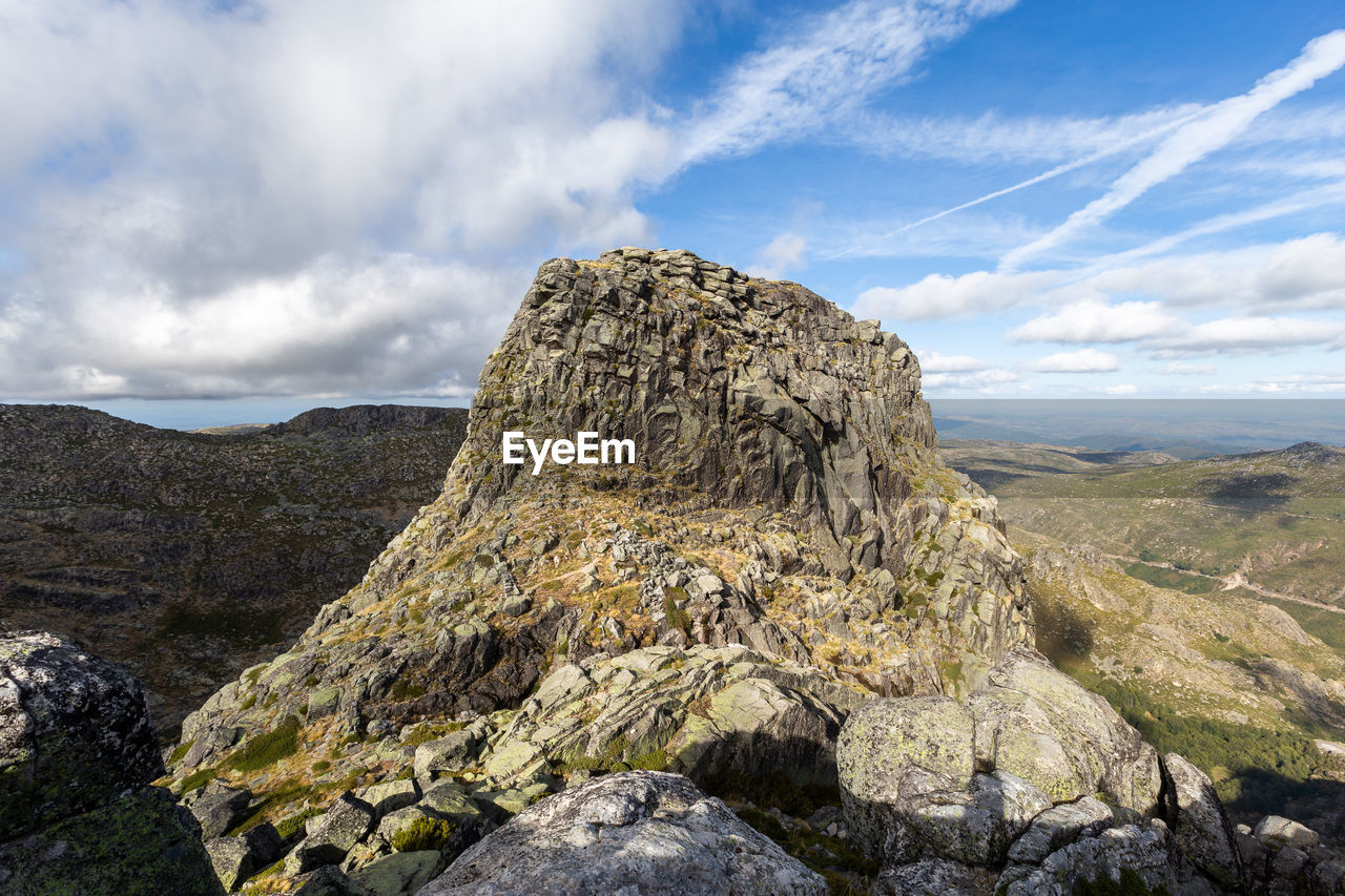 Panoramic view of rock formations against sky