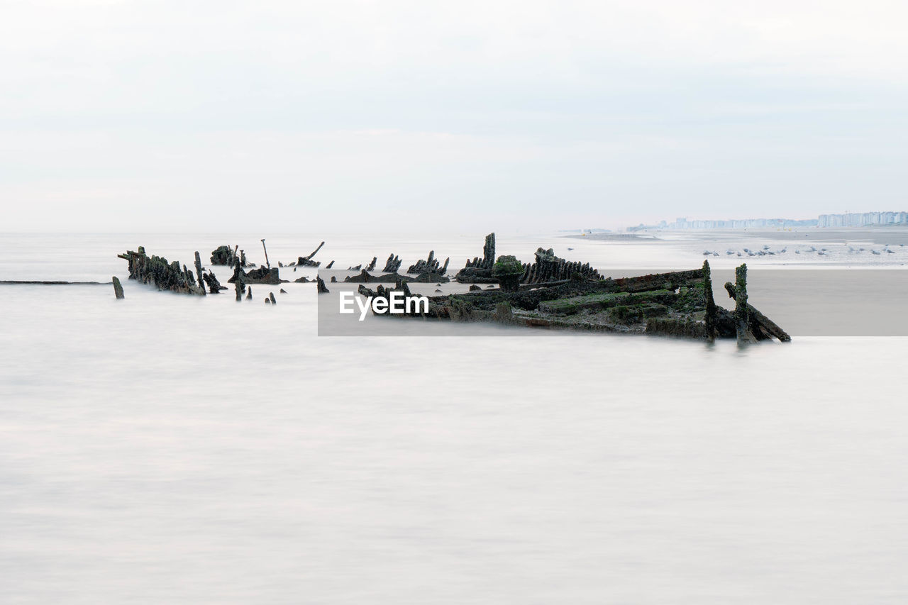 Shipwreck from world war in close distance of a beach in northern france,