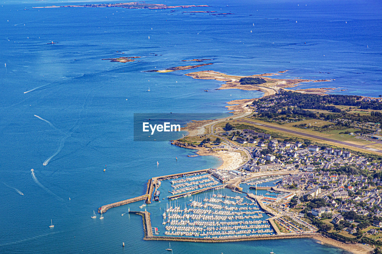 high angle view of city by sea