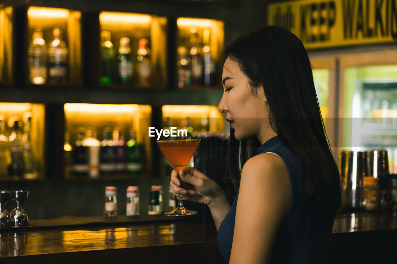 young woman drinking wine