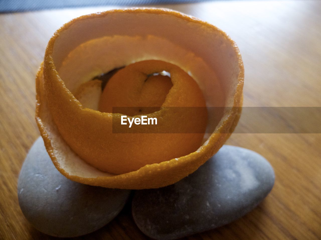 Close-up of orange peels on stones