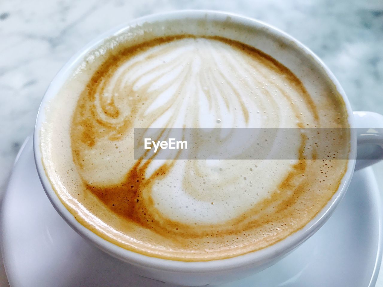 CLOSE-UP OF CUP OF CAPPUCCINO