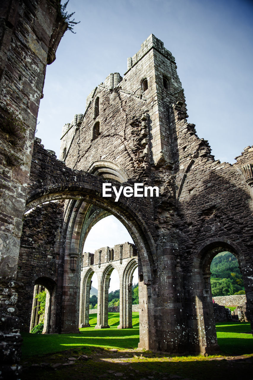 Low angle view of old ruins against clear sky