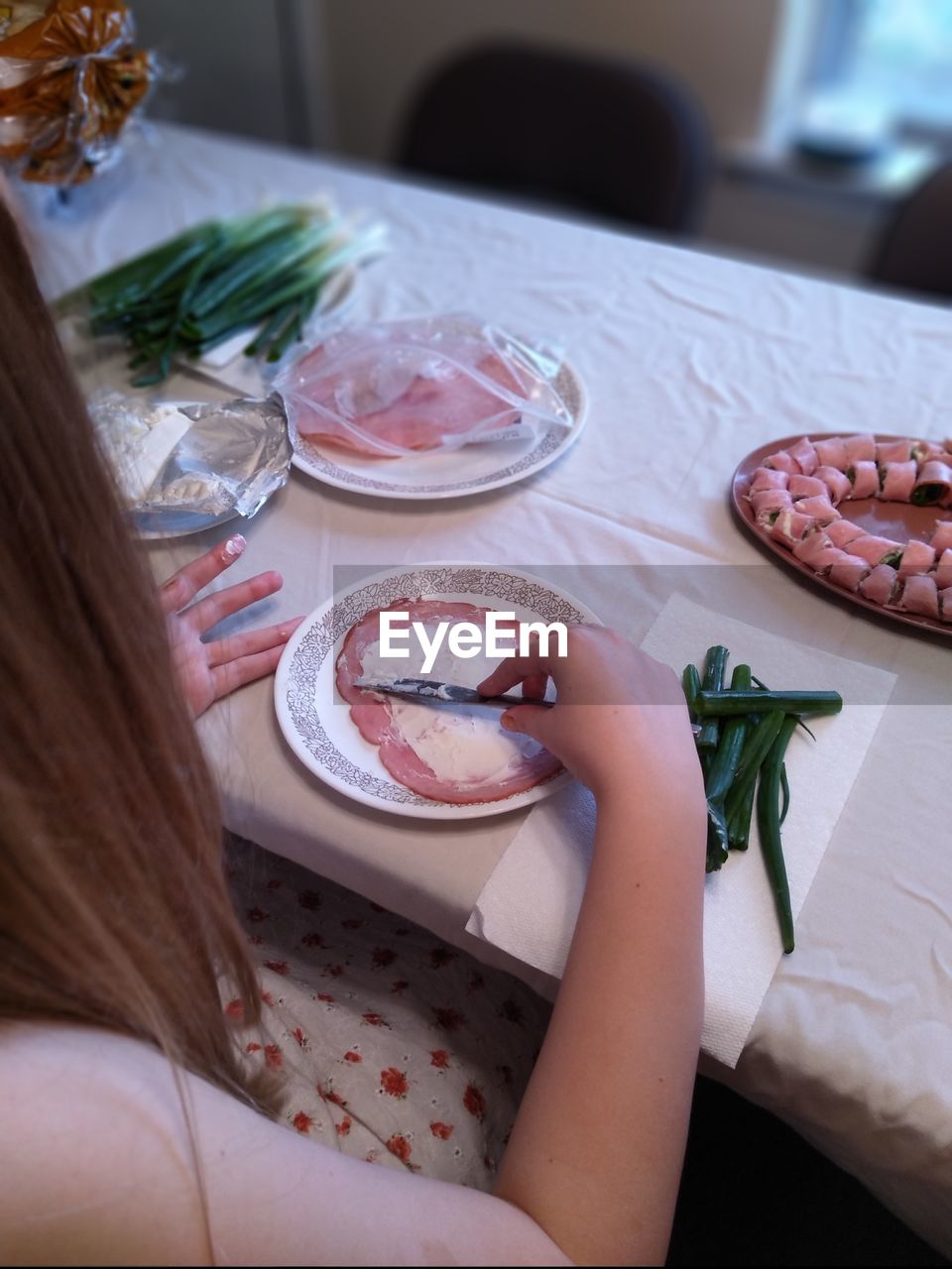 High angle view of woman preparing food on table