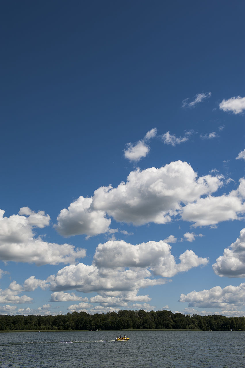 Scenic view of sea against blue sky