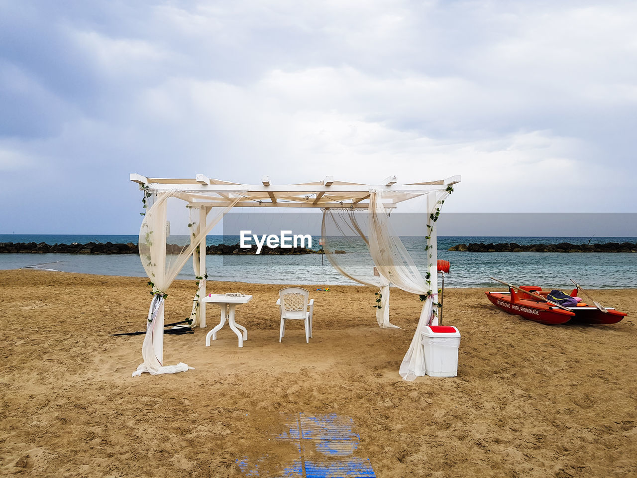 LIFEGUARD HUT ON SHORE AGAINST SKY