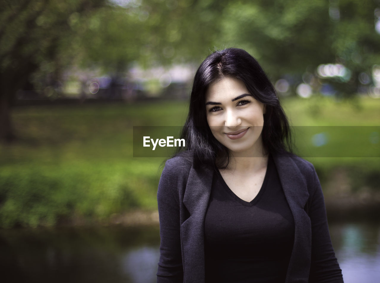 Portrait of beautiful woman at park