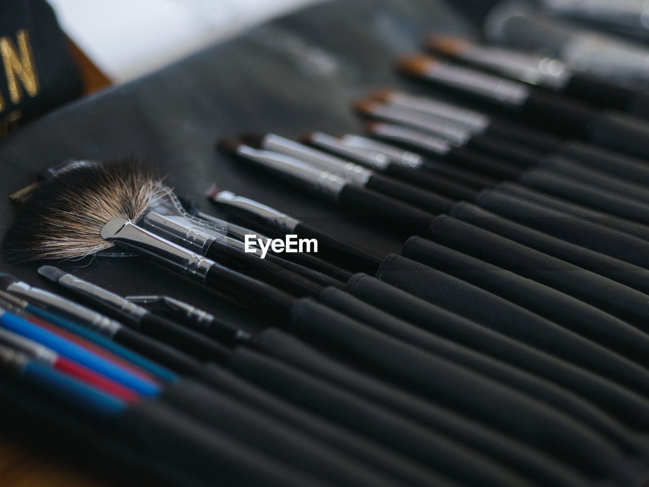 Close-up of various brushes on table