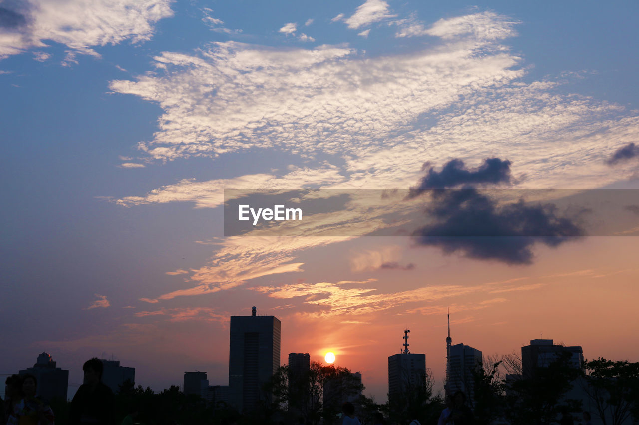 Cityscape against sky during sunset