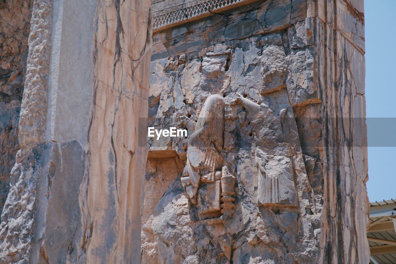 CLOSE-UP OF A SCULPTURE OF TEMPLE