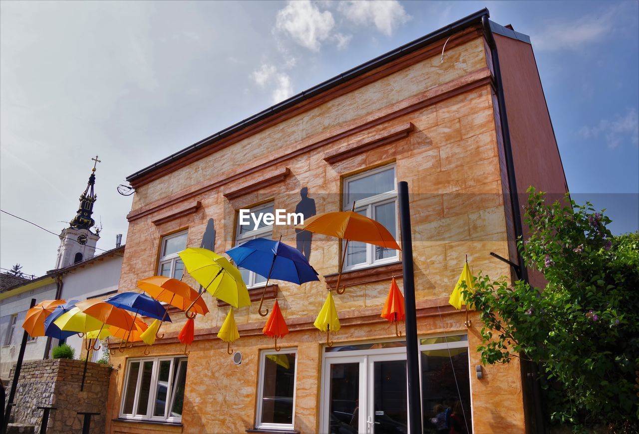 LOW ANGLE VIEW OF FLAGS AGAINST SKY