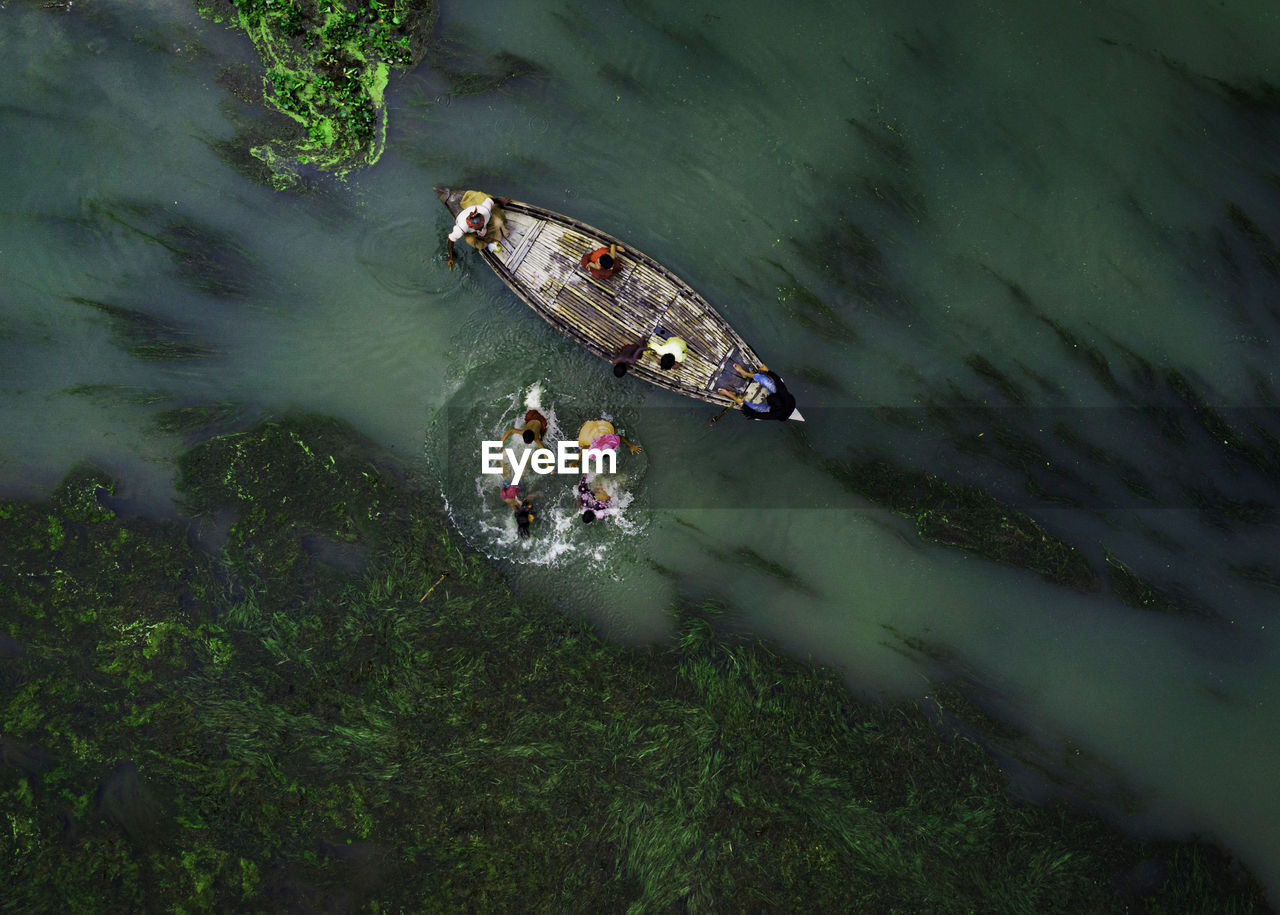 High angle view of people on boat in river