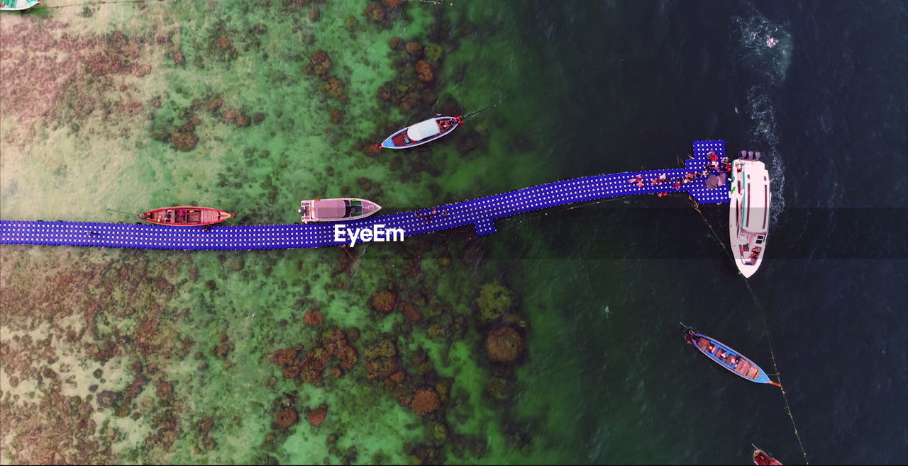 High angle view of boats moored in lake