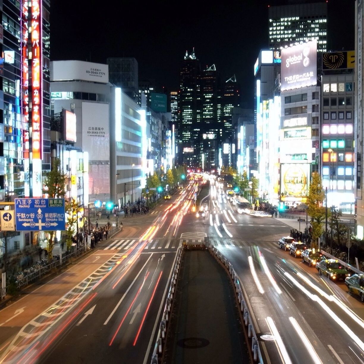 TRAFFIC ON CITY STREET AT NIGHT