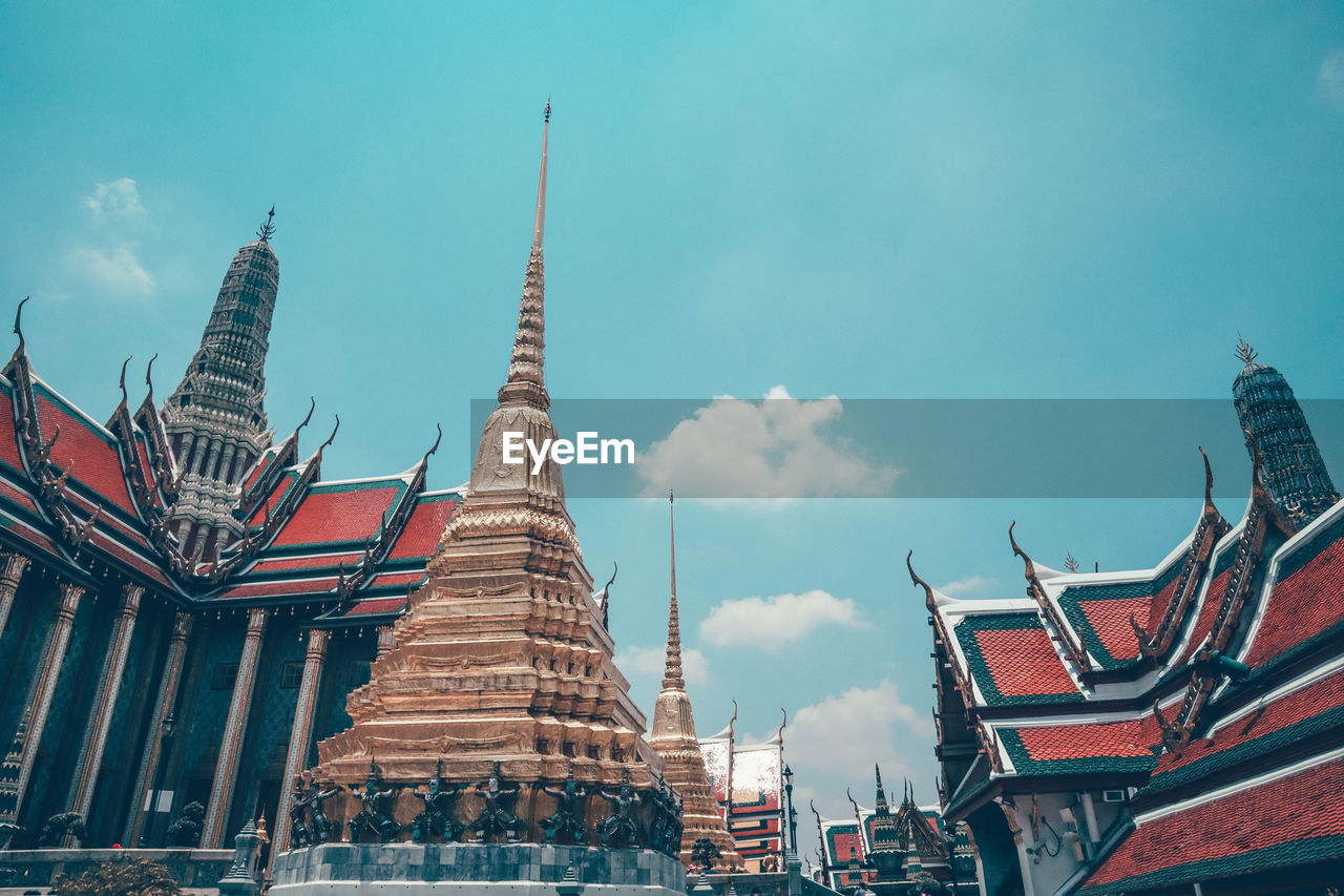 LOW ANGLE VIEW OF TEMPLE AGAINST BUILDINGS