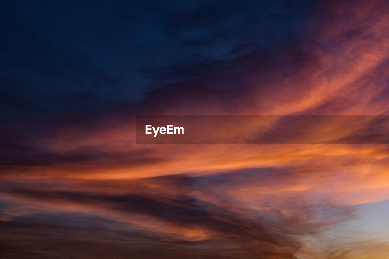 Low angle view of dramatic sky during sunset