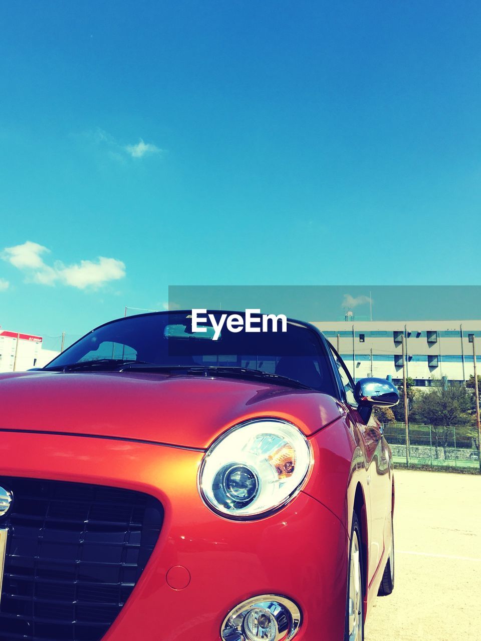 CLOSE-UP OF VINTAGE CAR AGAINST SKY