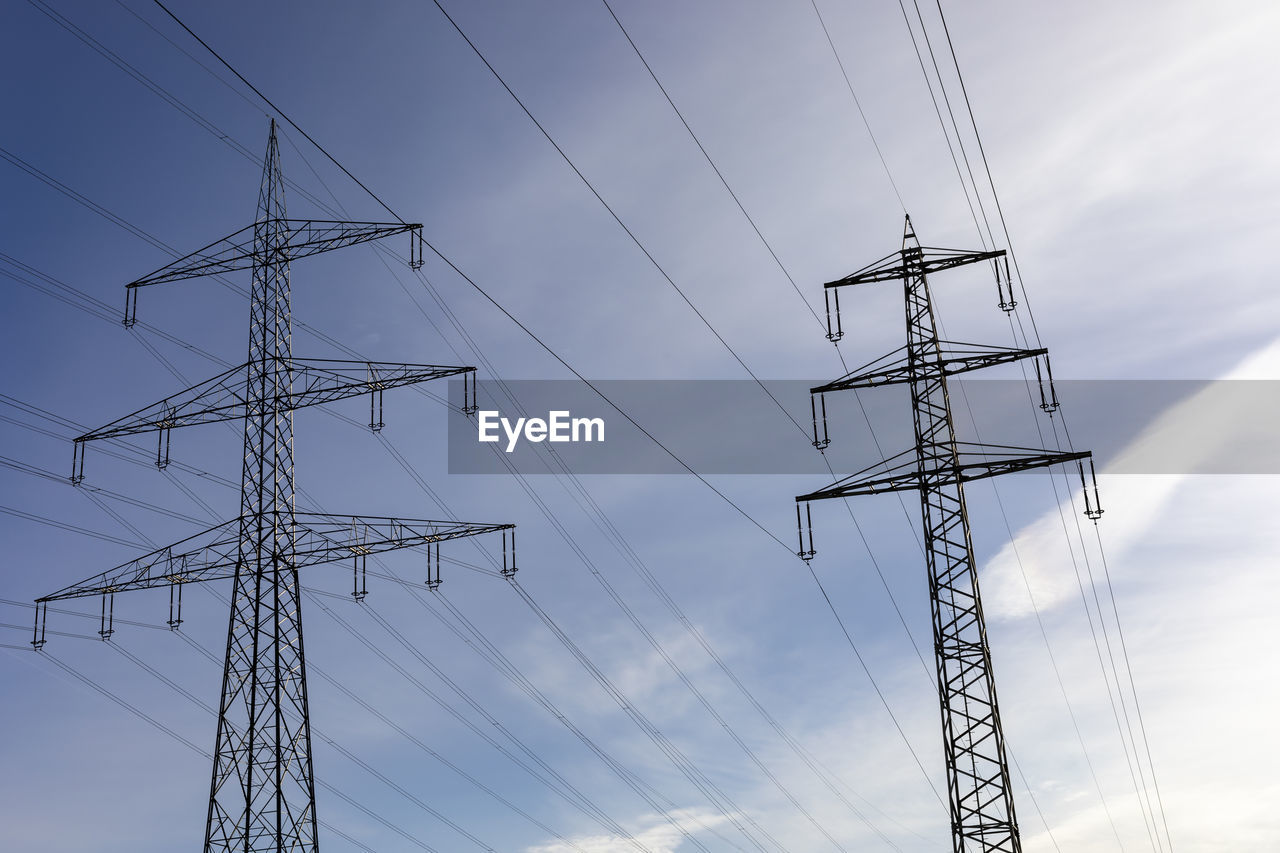 LOW ANGLE VIEW OF POWER LINES AGAINST SKY