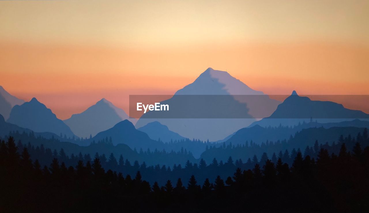 SCENIC VIEW OF SILHOUETTE MOUNTAINS AGAINST ORANGE SKY