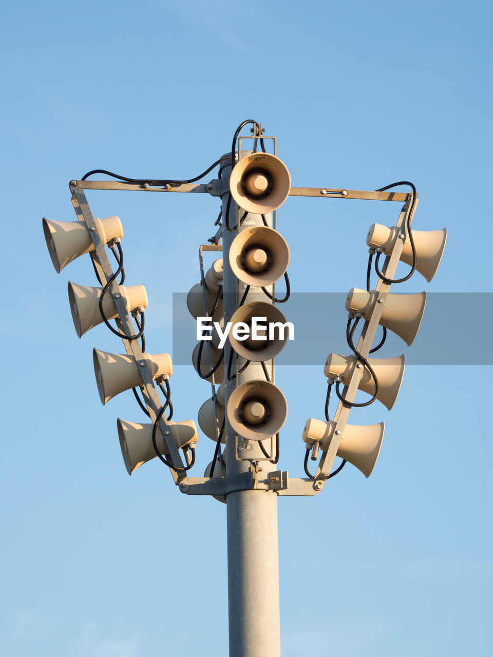 Low angle view of megaphones against clear sky