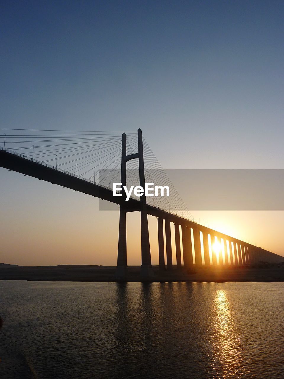 View of suspension bridge at sunset