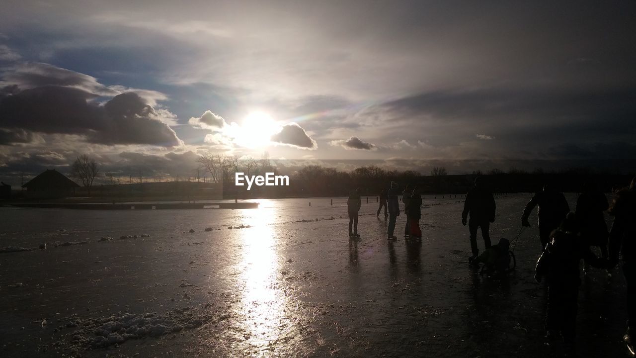 SCENIC VIEW OF SUNSET OVER WATER