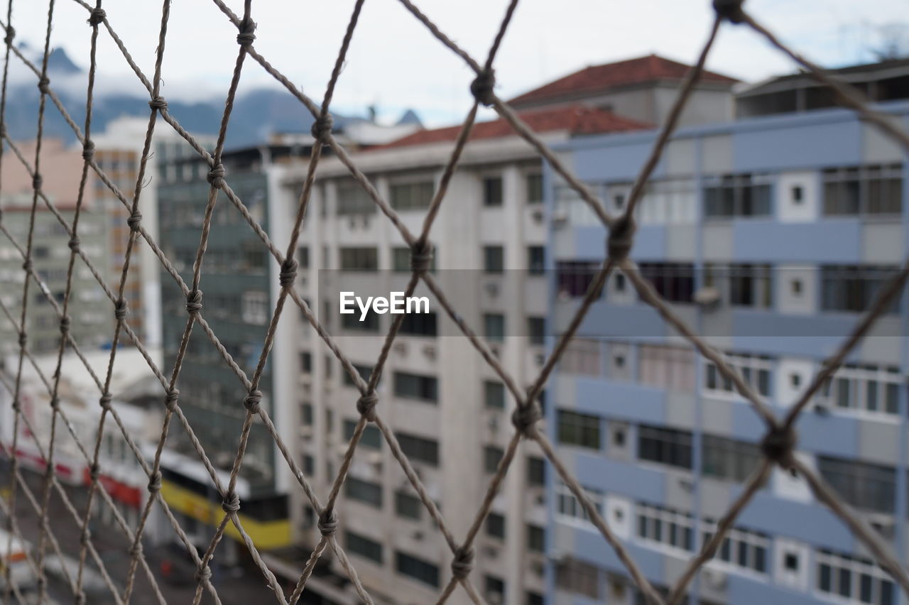 City seen through chainlink fence