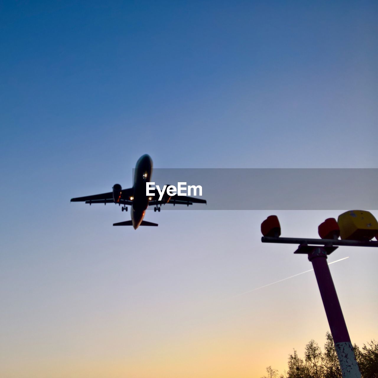 Low angle view of airplane against clear sky