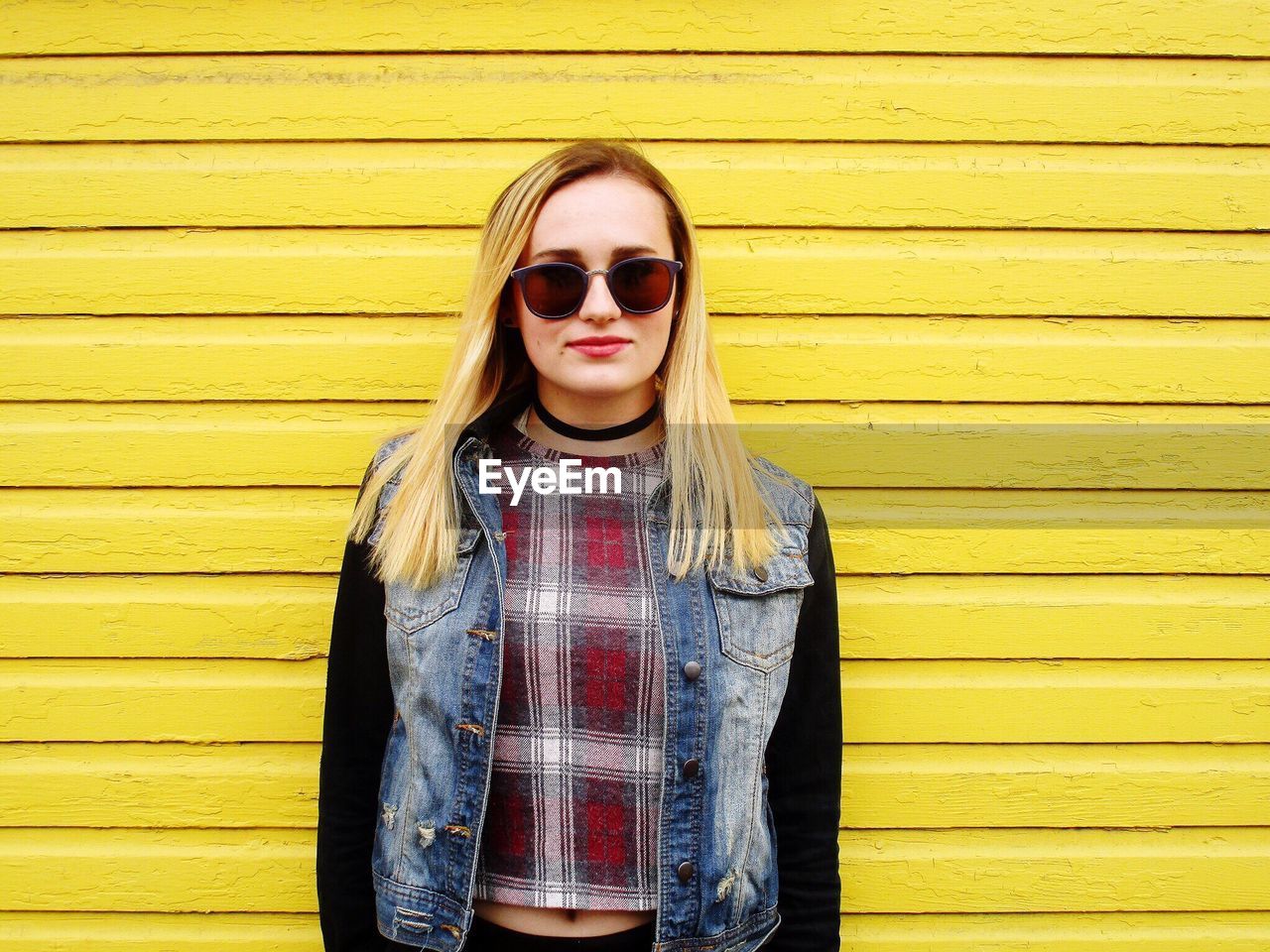 Portrait of young woman wearing sunglasses