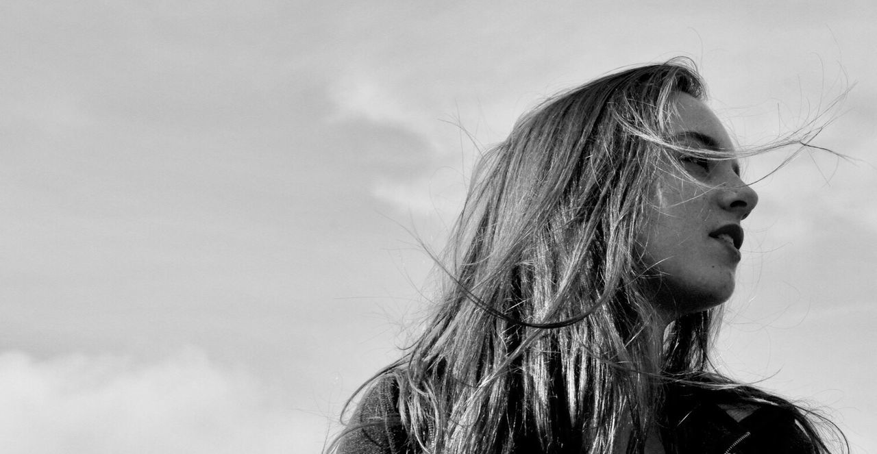 Close-up of woman against sky