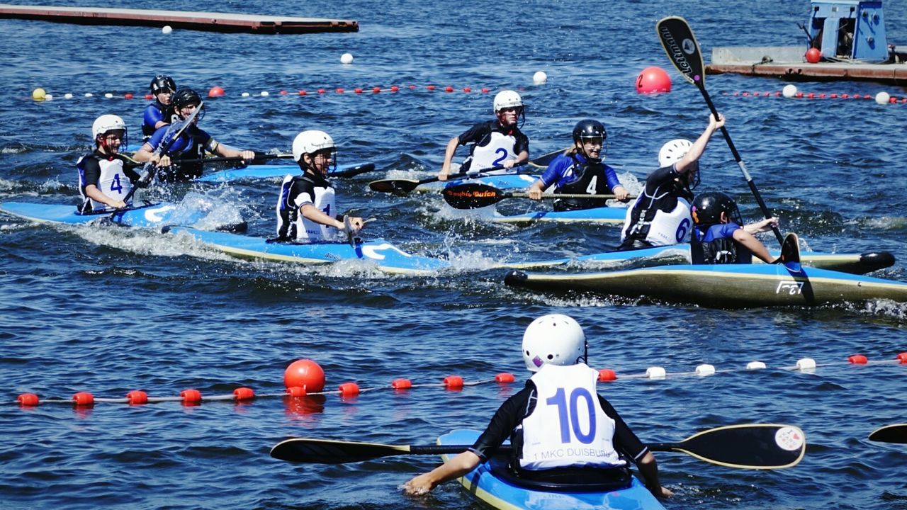 PEOPLE ON BOAT IN WATER