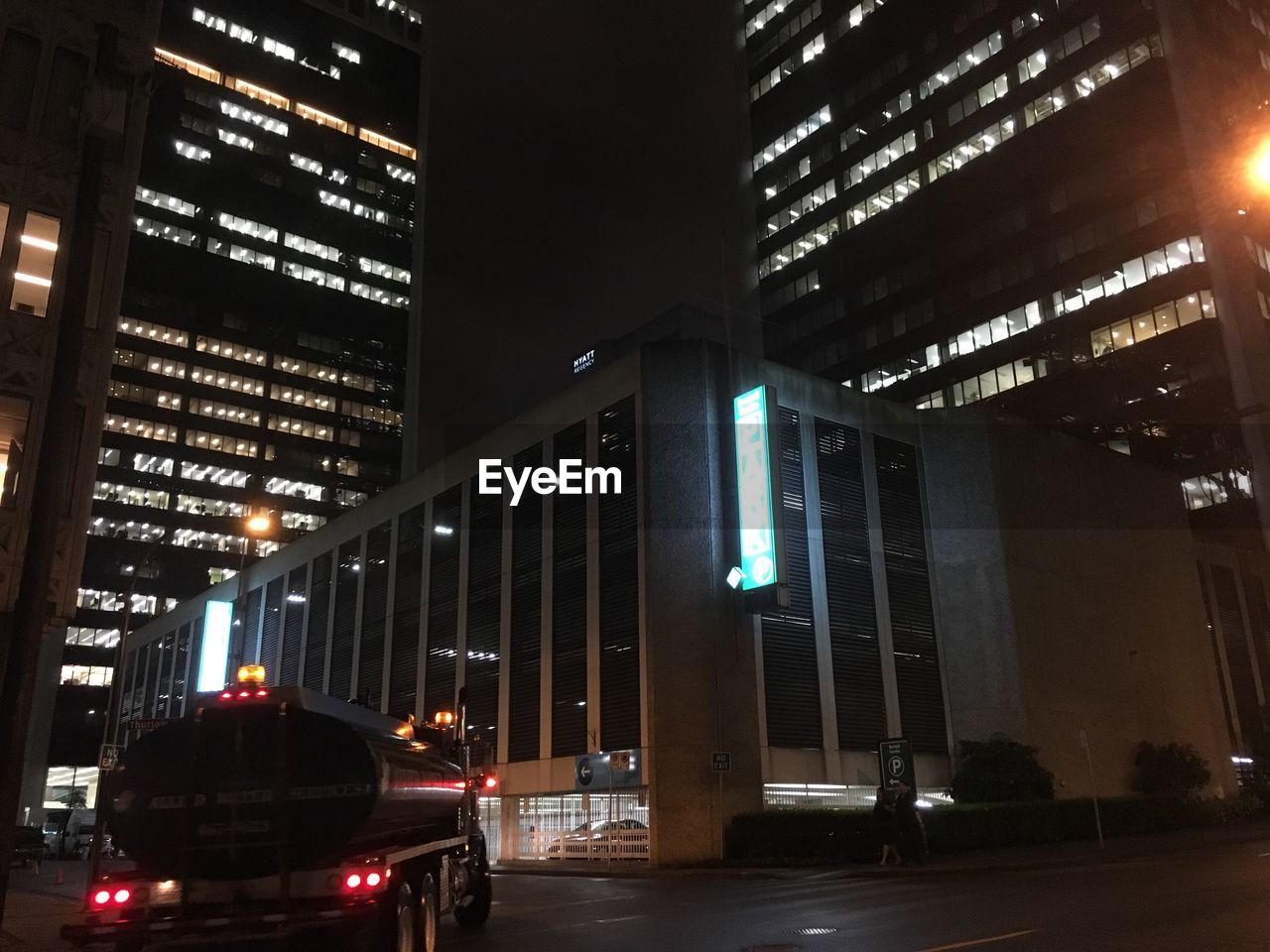 VIEW OF ILLUMINATED BUILDINGS AT NIGHT