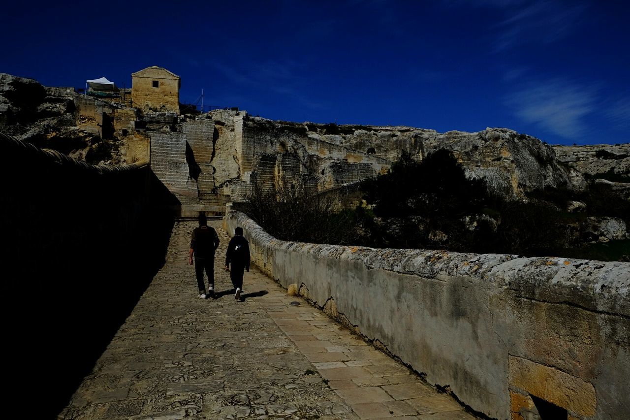 REAR VIEW OF PEOPLE ON FORT