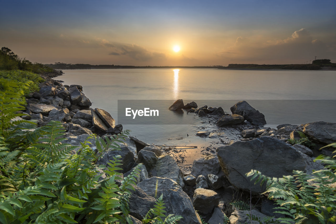 Scenic view of sea against sky during sunset