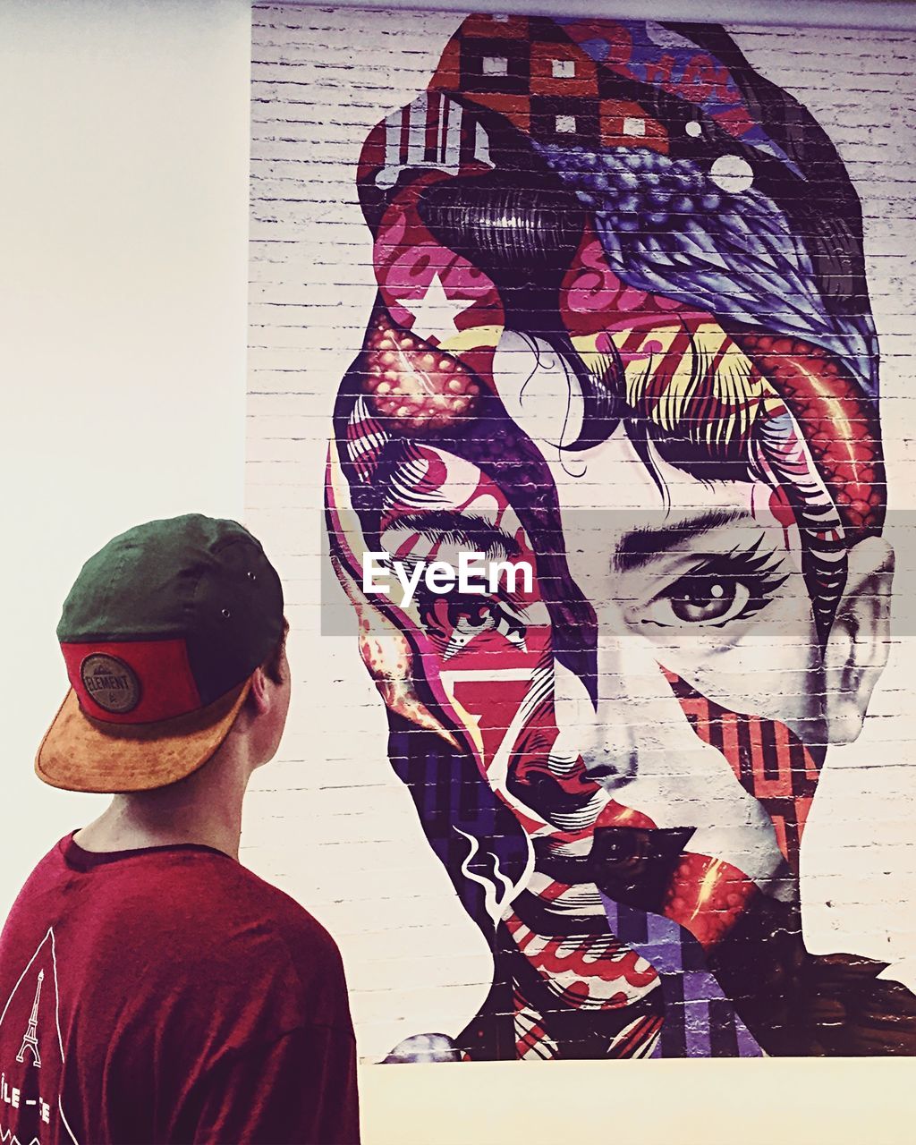 CLOSE-UP OF WOMAN STANDING ON WALL