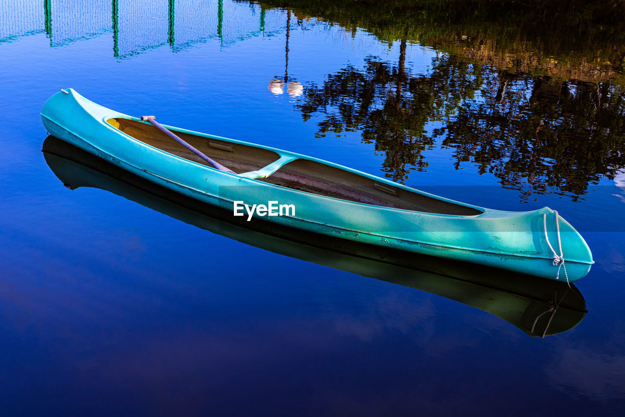 Old canoe on a lake.