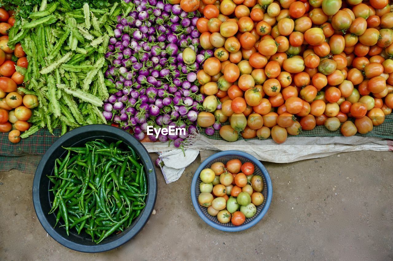 HIGH ANGLE VIEW OF FRUITS FOR SALE IN MARKET STALL