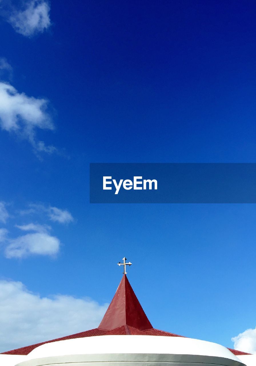 High section of chapel against blue sky