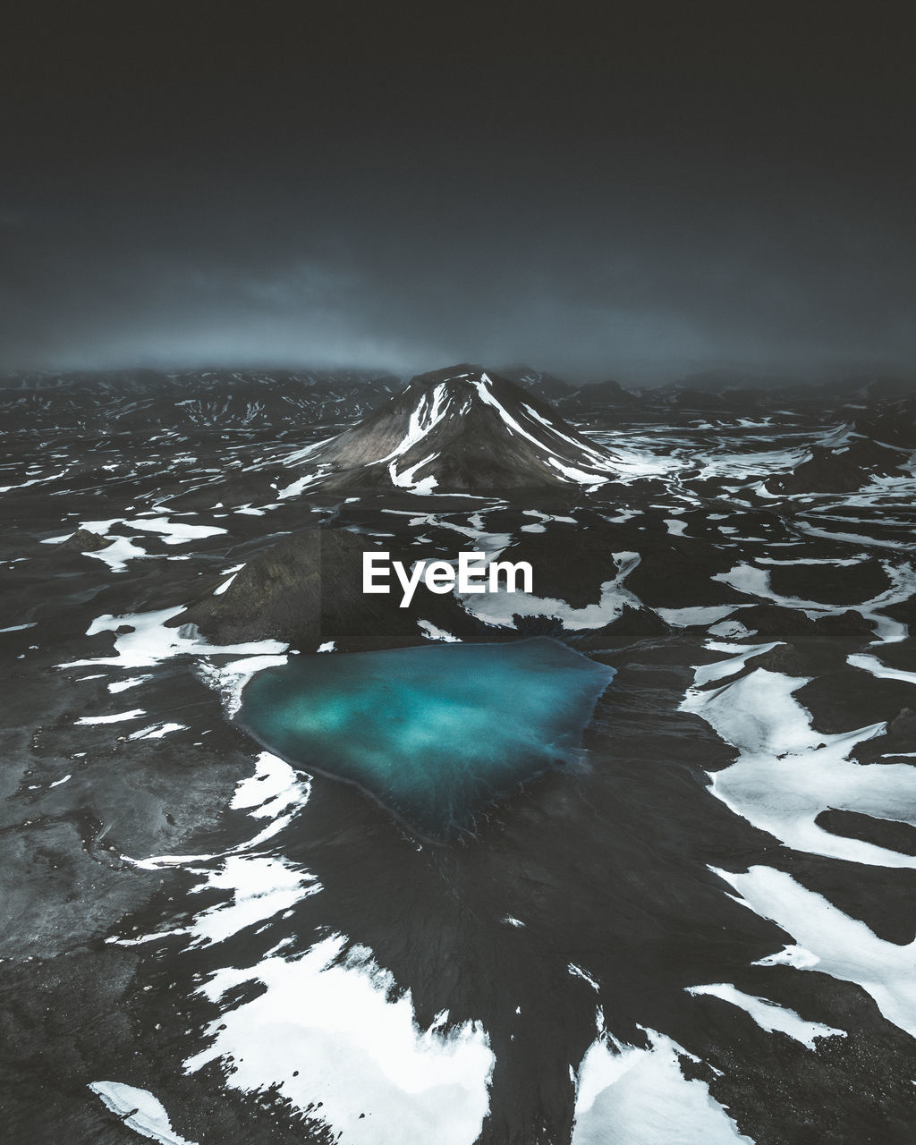 Scenic view of frozen pond against sky during winter